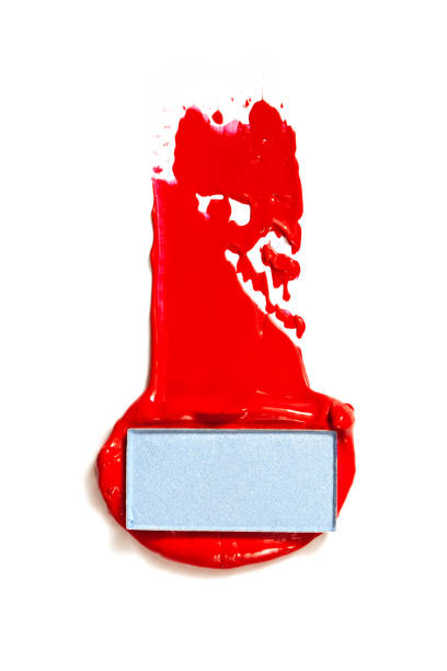 istock Texture of classic red lipstick on a white background close-up. 1203819097