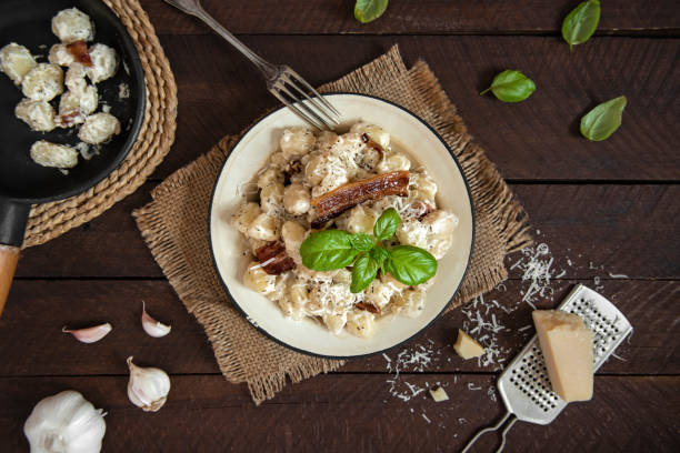 istock Homemade gnocchi with bacon and parmesan cheese 1203819978