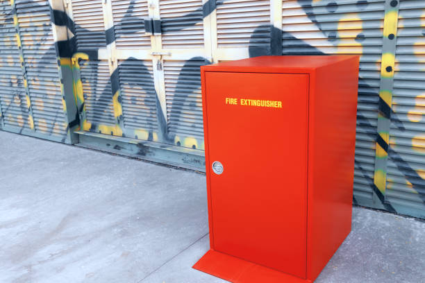 istock Fire Extinguisher red closet standing near building 1203821364