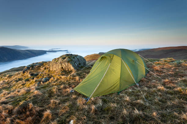 wild camp with green tent and cloud inversion in the english lake district - wastwater lake imagens e fotografias de stock