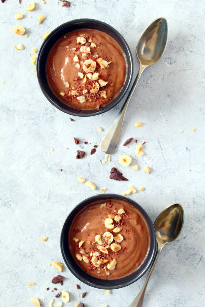 istock Chocolate smoothie with banana and nuts. Protein smoothie. 1203824680