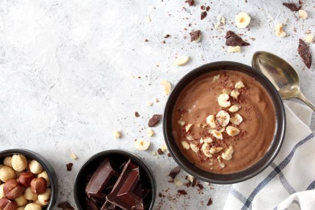 istock Chocolate smoothie with banana and nuts. Protein smoothie. 1203825309