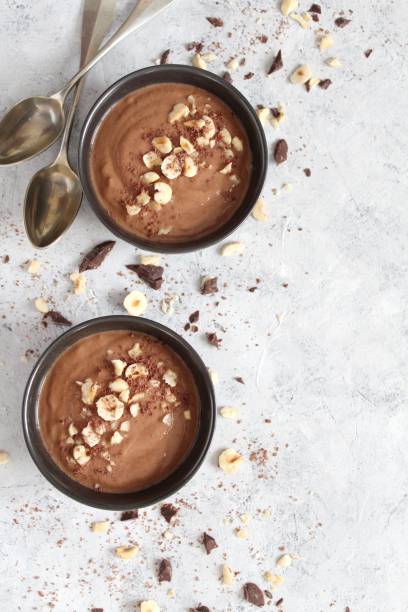istock Chocolate smoothie with banana and nuts. Protein smoothie. 1203825436