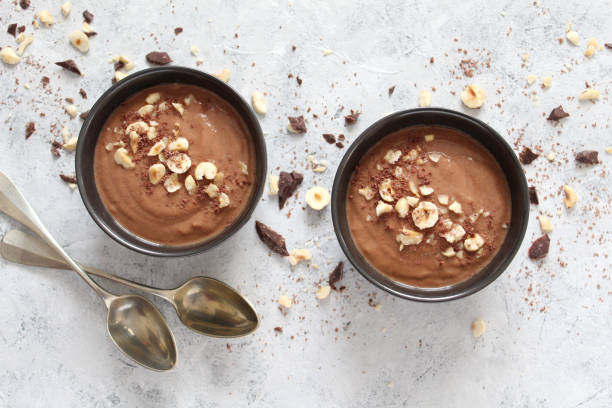 istock Chocolate smoothie with banana and nuts. Protein smoothie. 1203825489