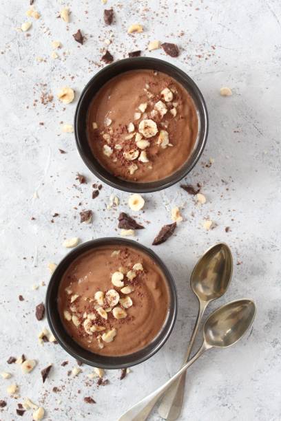 istock Chocolate smoothie with banana and nuts. Protein smoothie. 1203825520