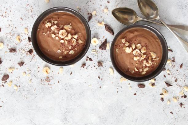 istock Chocolate smoothie with banana and nuts. Protein smoothie. 1203825522