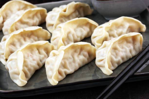 istock Gyoza or dumplings snack with soy sauce. 1203825766