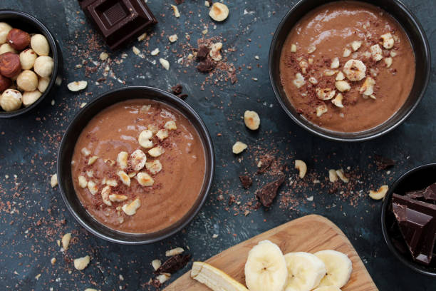 istock Chocolate smoothie with banana and nuts. Protein smoothie. 1203826449