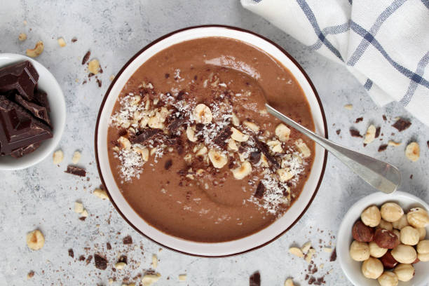 istock Chocolate smoothie with banana and nuts. Protein smoothie. 1203826695