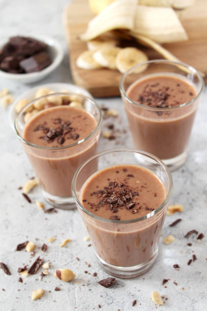 istock Chocolate smoothie with banana and nuts. Protein smoothie. 1203826765