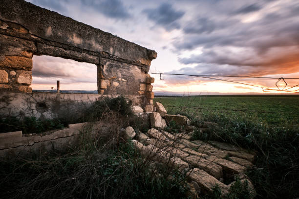 Stop looking at the walls, look out the window. The sicilian countryside viewed from a window between ruined walls