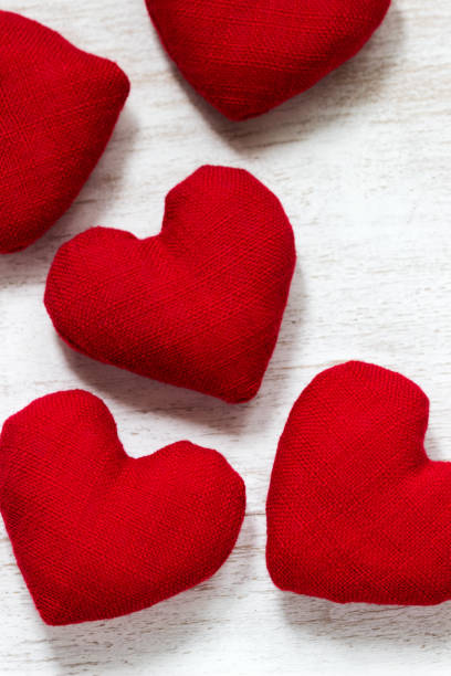 istock Red textile hearts on a white background. Valentine's day concept. 1203826969