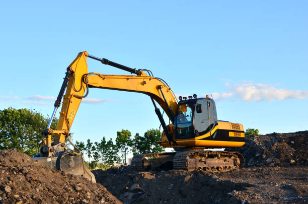 istock Excavator with crusher bucket for crushing concrete. Construction waste recycling for construction mix 1203827194