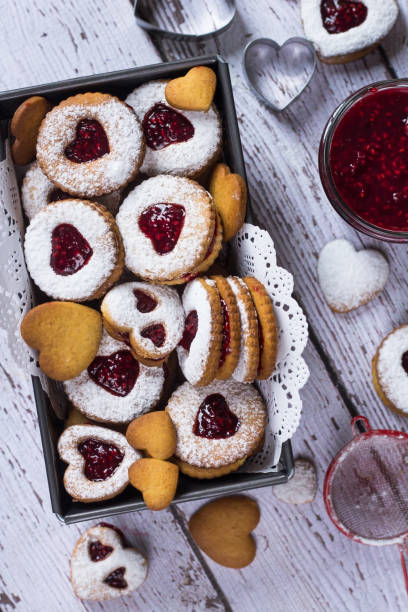 istock Homemade heart shaped linzer cookies with raspberry jam. Close up. Baking with love concept. 1203828478