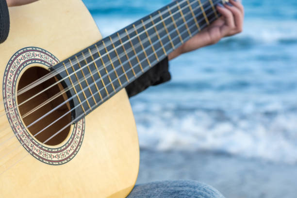 istock Girl with a guitar 1203831847