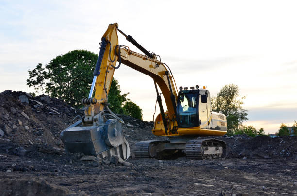 istock Excavator with crusher bucket for crushing concrete at construction site 1203834040