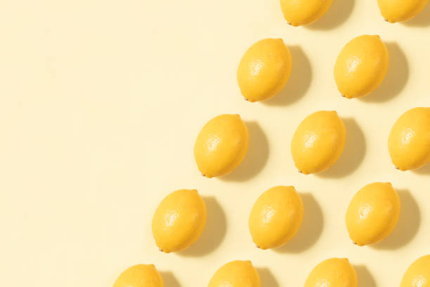 Lemons in A Row on Yellow Background