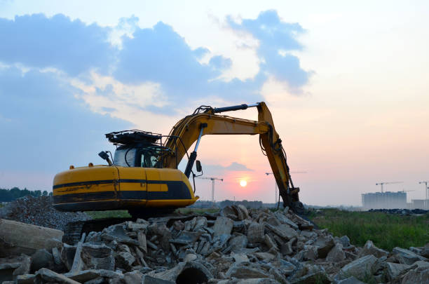 istock Excavator with crusher bucket for crushing concrete. 1203836695