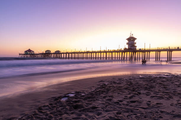 istock Huntington Beach pier and beach at sunset 1203839532