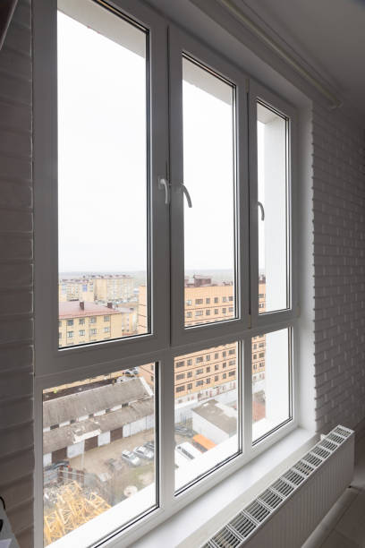 istock Stained glass high and wide plastic windows in the apartment 1203839716