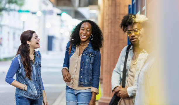 istock Multi-ethnic young adults hanging out in the city 1203843225