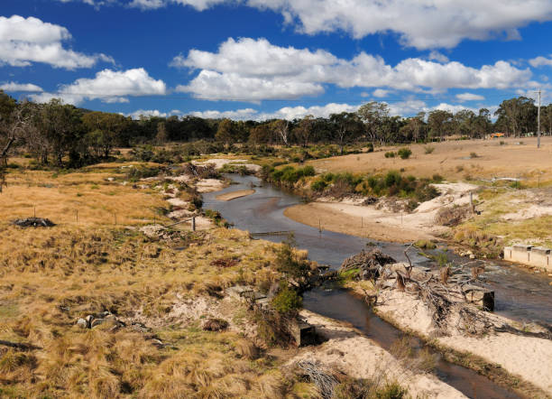 Barren Landscape At Tenterfield Creek With A Blue Sky An A Few Clouds In The Background