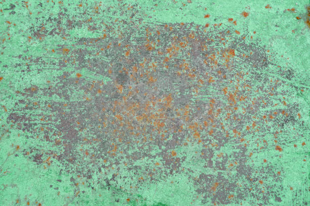 istock Background of green paint and rusty metal, closeup texture 1203846263