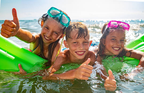 istock Kids in the sea 1203848342