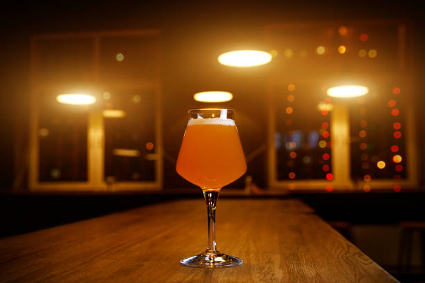 Glass of craft beer on a table in pub,