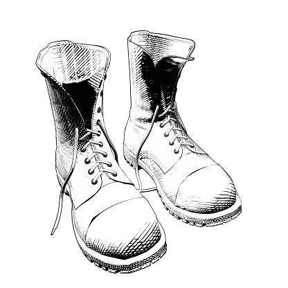 Monochrome vintage engraving drawing a pair of boots illustration isolated on white background