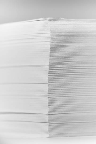 istock Stack of office paper, on a white background. Concept, minimalism 1203853316