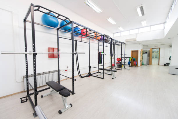 istock Large Modern Gym With Workout Equipment 1203854328