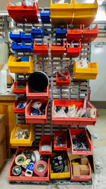 istock Old untidy spare parts rack in an engineers workshop 1203854366