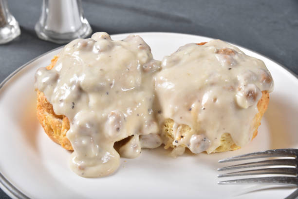 istock Homemade biscuits with country gravy and sausage 1203856840