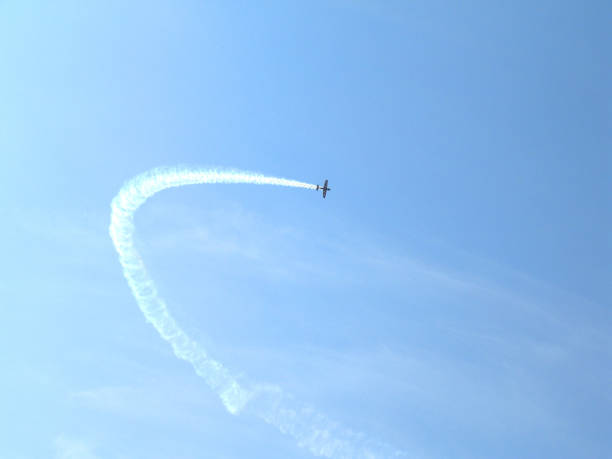 istock inversion trace of a jet plane when flying in the sky 1203864092