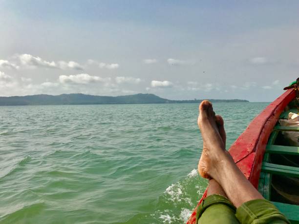istock Man on a boat in Guinea 1203867925