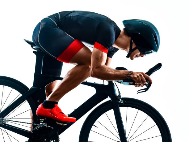 istock triathlete triathlon Cyclist cycling silhouette isolated white background 1203868601