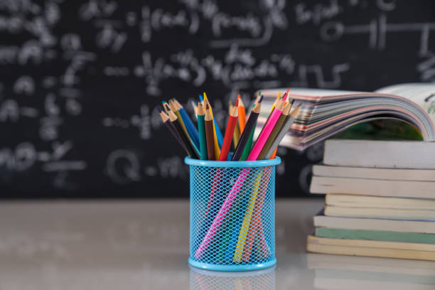istock School books on desk, education concept. 1203878954