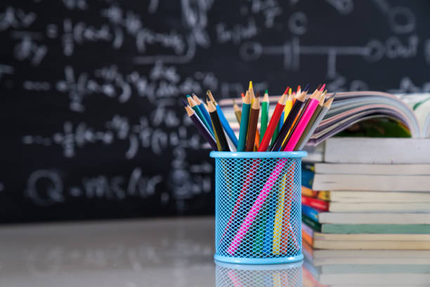 istock School books on desk, education concept. 1203878955