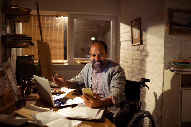 istock Mature man using a phone in his office 1203880787