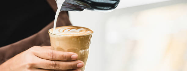 istock Professional barista making latte art coffee 1203881430