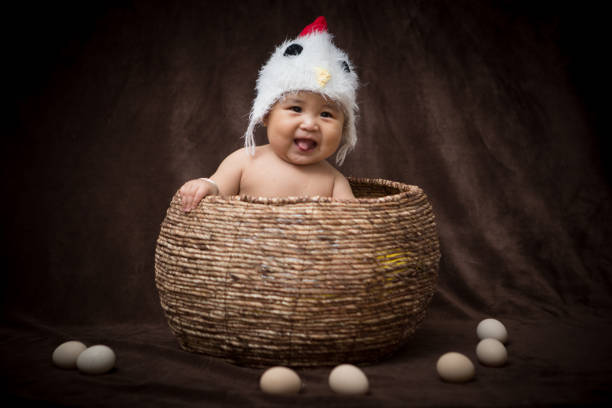 istock Baby in Costume like chick 1203881632