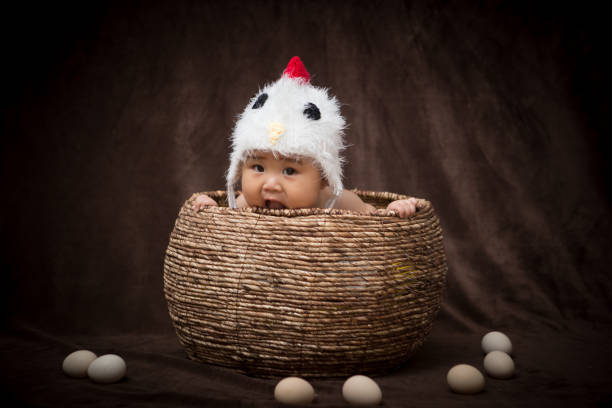 istock Baby in Costume like chick 1203881640