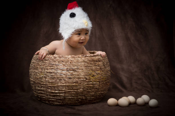 istock Baby in Costume like chick 1203881644