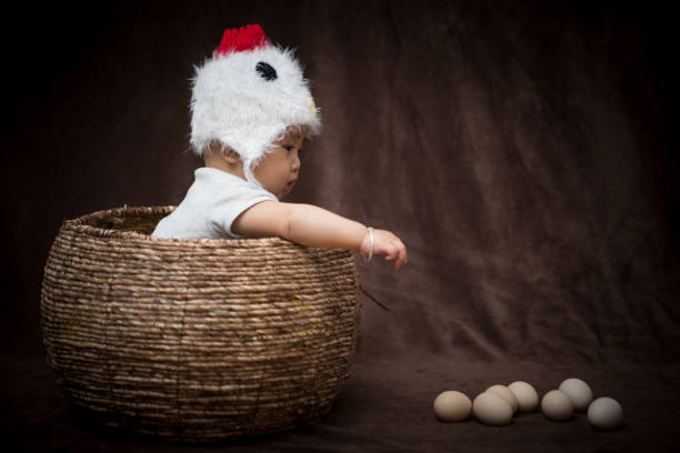 istock Baby in Costume like chick 1203881646