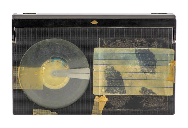 istock Old betamax video cassette isolated on white background. Vintage video technology. Blank, weathered sticker. 1203883603