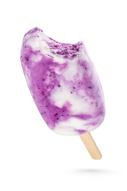 istock Vanilla and fruit ice cream popsicle isolated on white 1203885516