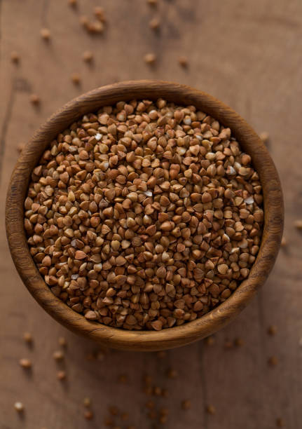 istock buckwheat on wooden surface 1203889051