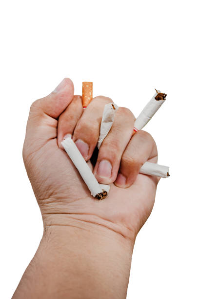 istock Cigarette on the palm. smoking stop 1203891586
