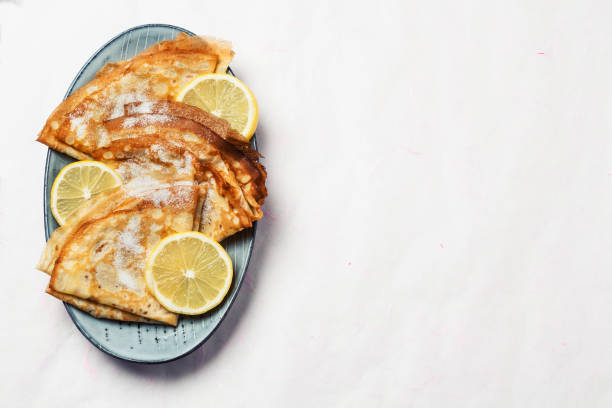 istock Shrove Tuesday pancakes with lemon 1203894156